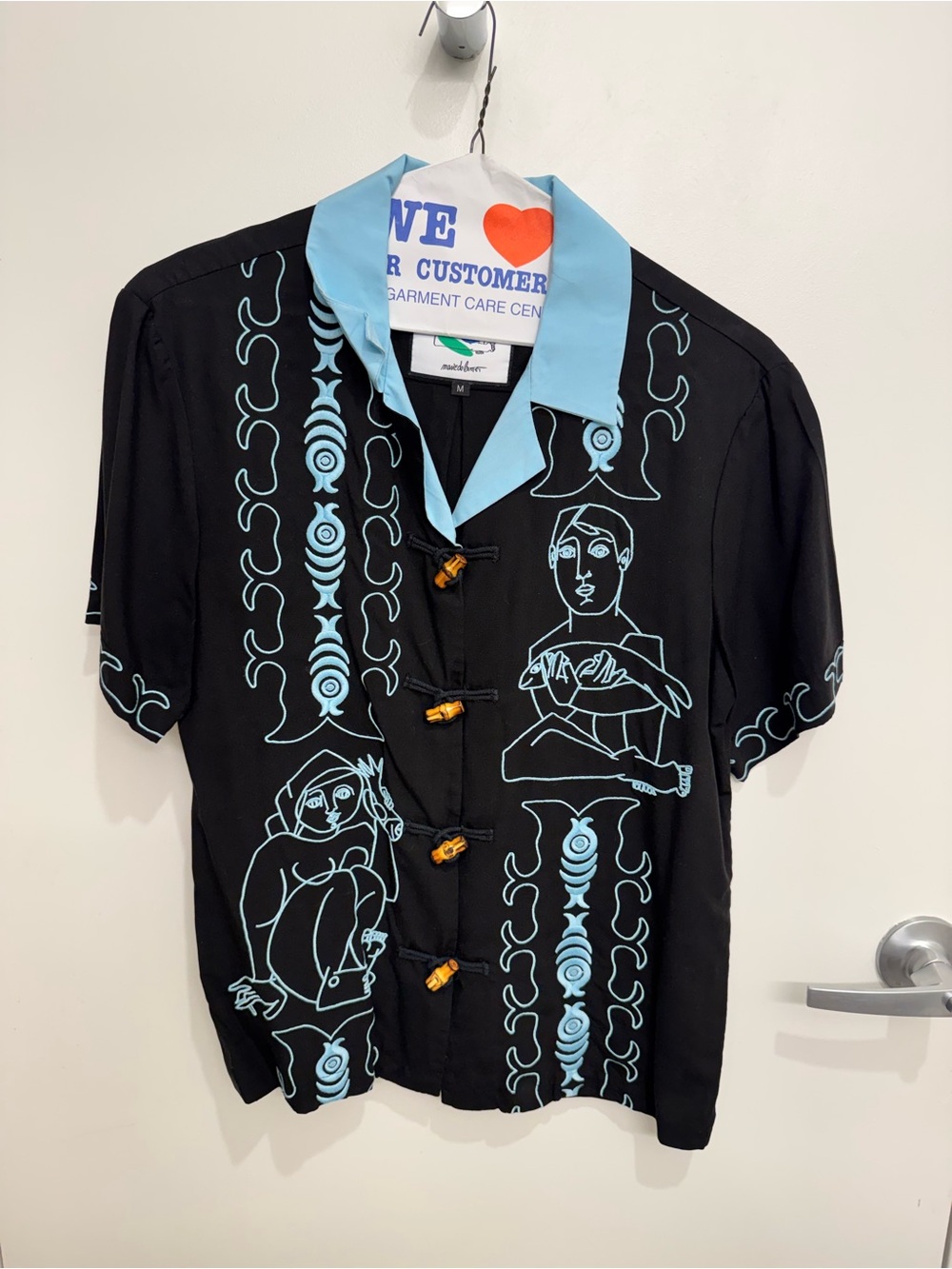 TOMBOLO: Black Button-Up Shirt with Light Blue Collar and Graphic Line Art
